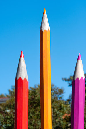 large decorative colored wooden pencils on defocused background, back to school conceptの写真素材