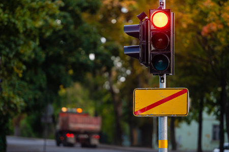 traffic semaphore with red light on defocused background of autumn city, close-upの写真素材