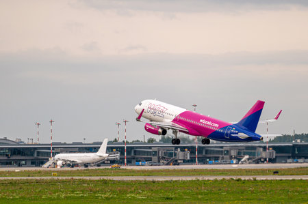 Riga, Latvia - August 31, 2021: Wizzair Airbus A320 HA-LYM takes off from RIX International Airport on cloudy autumn dayのeditorial素材