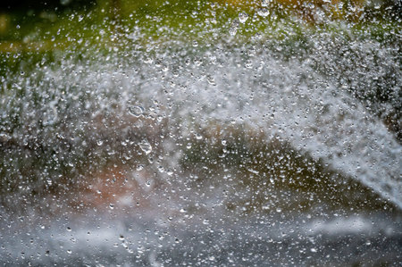 water splash with small drops in fountain, abstract natural background, selective focus, close-upの写真素材