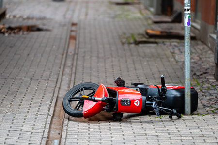 Riga, Latvia - November 4, 2022: sharing and rental service RIDE electric bike Xiaomi HIMO T1 is overturned on a paved sidewalkのeditorial素材