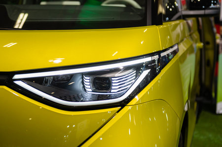Riga, Latvia, April 28, 2023: LED headlights and car design closeup of nev Volksvagen ID. Buzz electric minivan, model 2023のeditorial素材