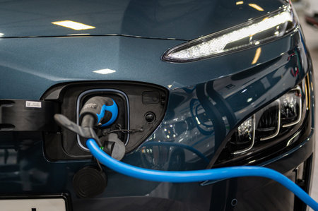 Riga, Latvia, April 28, 2023: Hyundai  KONA Electric connected to the charger, charging an car battery at the stationのeditorial素材