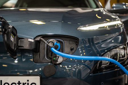 Riga, Latvia, April 28, 2023: Hyundai  KONA Electric connected to the charger, charging an car battery at the stationのeditorial素材