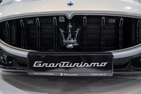Riga, Latvia, April 28, 2023: close-up of exterior design details of the supercar Maserati Granturismo, trident logoのeditorial素材