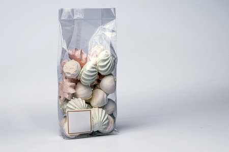 pack with meringue cookies from egg whites, selective focus, close - up, isolated, copy spaceの写真素材
