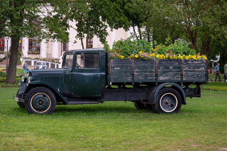 Pakruojis, Lithuania. July 1, 2023: Flower festival in Pakruojis manor. A historic Citroen U23 truck with a load of flowers.のeditorial素材