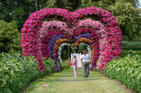 Pakruojis, Lithuania. July 1, 2023: Summer garden view of Pakruojis minor with heart-shaped flower archesのeditorial素材