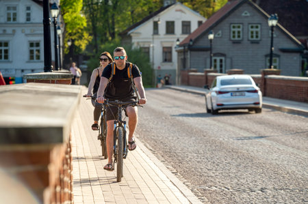 Engure, Latvia - May 13, 2023: Traffic over the ancient concrete bridge over the Venta river.のeditorial素材