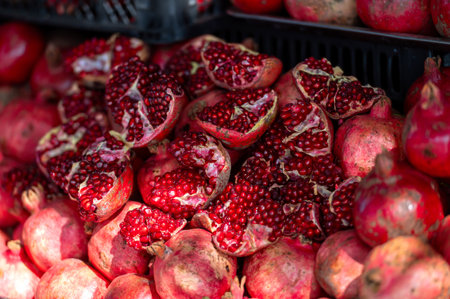 Close-up of red ripe pomegranate fruit on display at a farmers market in Georgiaの写真素材