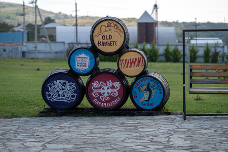 Patardzeuli, Georgia - October 7, 2023: Wooden barrels with traditional wine names at the KTW wineryのeditorial素材