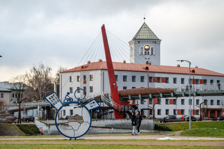 Jelgava, Latvia - January. 14. 2023:  View from the post island to the city skyline and the pedestrian cable-stayed bridge.のeditorial素材