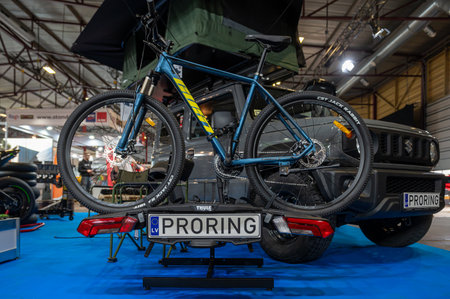 Riga, Latvia, April 19, 2024: camping tent on the roof and bicycle mount for transportation, tourism exhibitionのeditorial素材