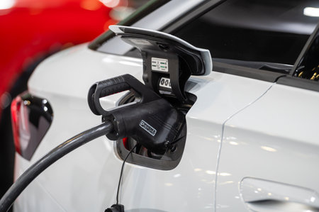 Riga, Latvia, April 19, 2024: Volkswagen ID.7 electric coupe SUV connected to the charger, eco friendly technologyのeditorial素材