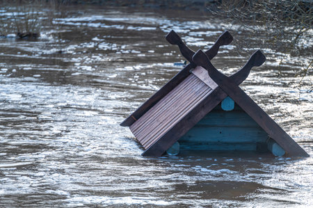to the roof of a bird house flooded in spring floods - a feeder on the Berze River in Dobele, Latviaの写真素材