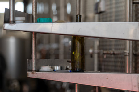 A solitary green bottle sits on a shelf in a winery facility.の写真素材