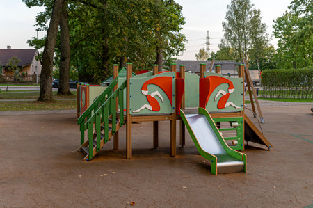 Childrens playground features climbing structures and a slide in a sunny afternoon setting.の写真素材