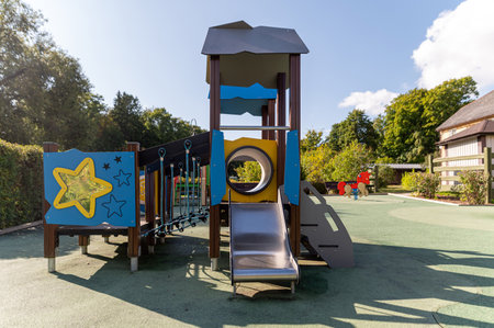 Children can enjoy climbing and sliding on this vibrant playground equipment in the park.