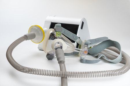 Continuous positive airway pressure system includes of CPAP machine, mask, tube on white background.の写真素材