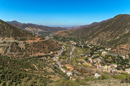 Breathtaking view of the Atlas Mountains showcasing lush valleys and small villages below.の写真素材