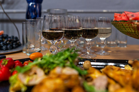 Friends celebrate together with delicious food and a variety of drinks at a gathering.