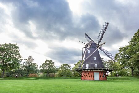 Old windmill in historical pak in Copenhagen, Denmarkの写真素材