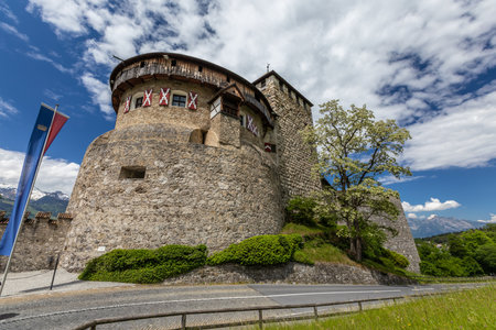 Vaduz Castle with mountain road in Liechtenstein. Alps landscape backgroundのeditorial素材