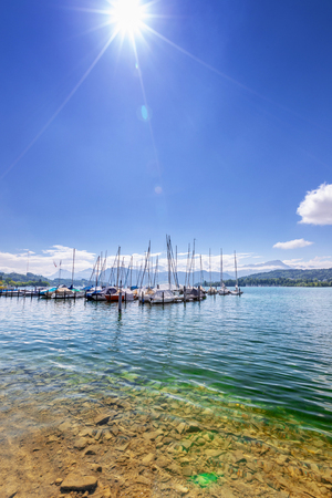Yacht on a clear mountain lake in the Swiss Alps. Landscape.の写真素材