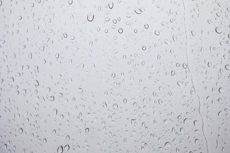 Wet glass background. Rain on the glass. Water drops