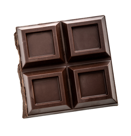 Pieces of dark chocolate isolated with shadow on white backgroundの写真素材