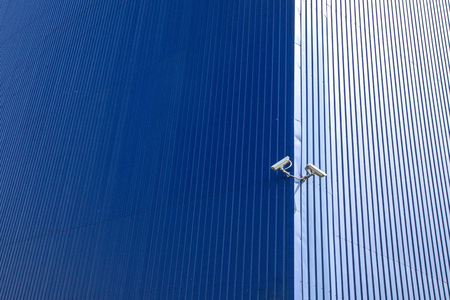 Surveillance cameras on the factory wall