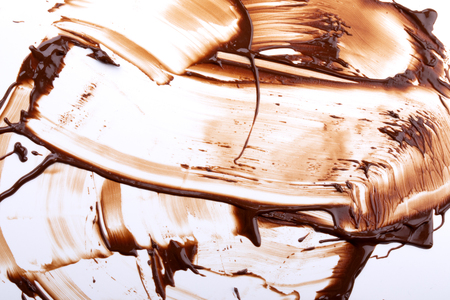 Background with melting chocolate dripsの写真素材