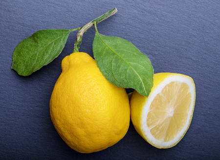 Background with lemons on the stone tableの写真素材