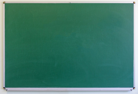 Blackboard with wooden frame, dirty chalkboard. Green color