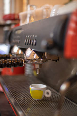 The hands of a barista brew cappuccino coffeeの写真素材