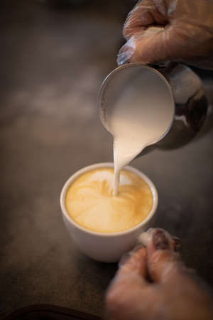 Croissants and coffee in a cozy dark cafeの写真素材