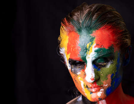 Model with makeup. Woman with colorful makeup and body artの写真素材