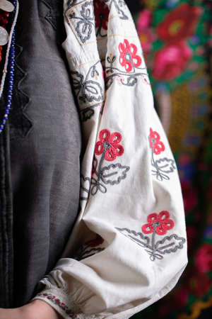 A girl in traditional Ukrainian clothing on black background
