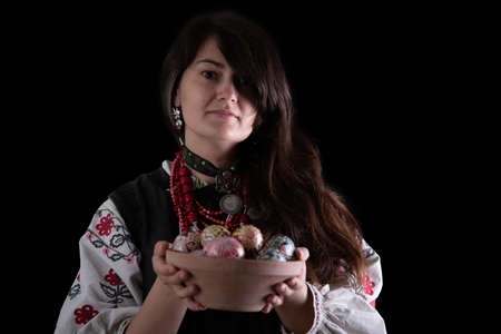 A girl in traditional Ukrainian clothing on black backgroundの写真素材
