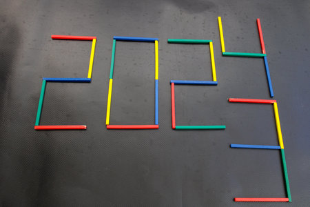 Happy New Year 2024 Idea. Transition from 2023 to new year 2024 concept with text on wooden blocks....