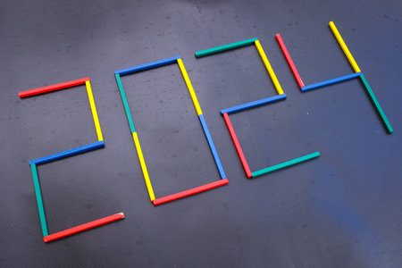 Happy New Year 2024 Idea. Transition from 2023 to new year 2024 concept with text on wooden blocks....