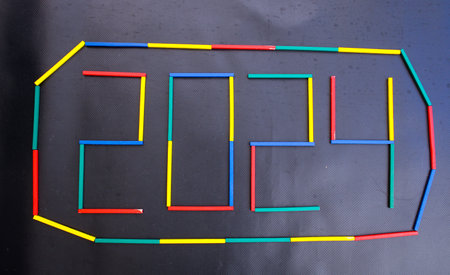 Happy New Year 2024 Idea. Transition from 2023 to new year 2024 concept with text on wooden blocks. Creative Concept.の写真素材