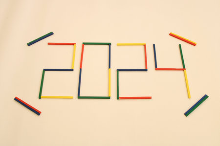 Happy New Year 2024 Idea. Transition from 2023 to new year 2024 concept with text on wooden blocks. Creative Concept.の写真素材