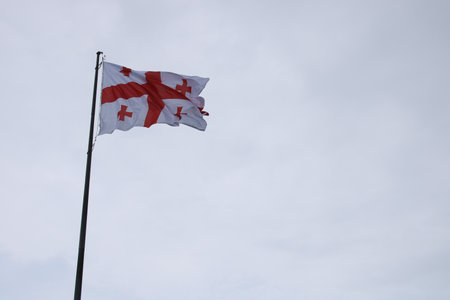 Georgian flag waving in the skyの写真素材