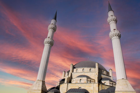 A large white mosque with two minarets. islamic architecture