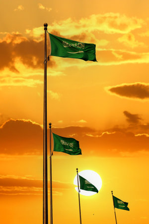 Saudi Arabia national flag waving at sunset. Islamic religion flag.の写真素材