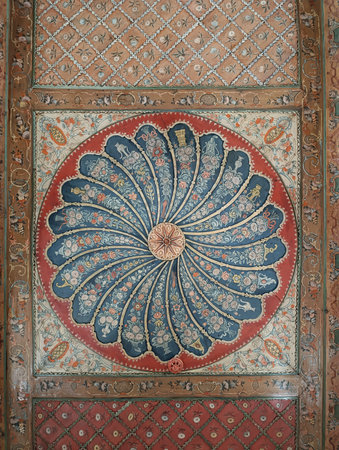 a large blue and red flowered rug with a spiral design on the bottom. high quality photoの写真素材