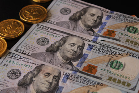A stack of dollar bills with the word United States written on it. Finance and economics. 100...