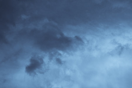 Stormy Cloudscape. blue and gray clouds. Cloud in the background. Phone or desktop wallpaper.の写真素材