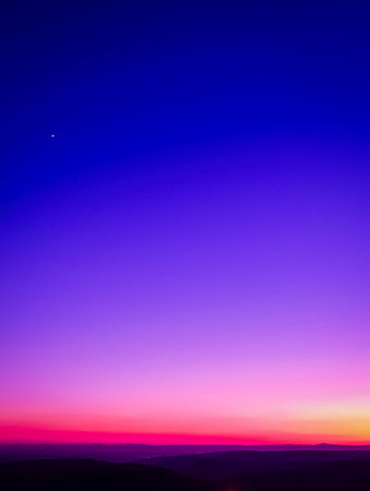 Beautiful sunset sky with blue and purple colors. Phone or desktop wallpaperの写真素材